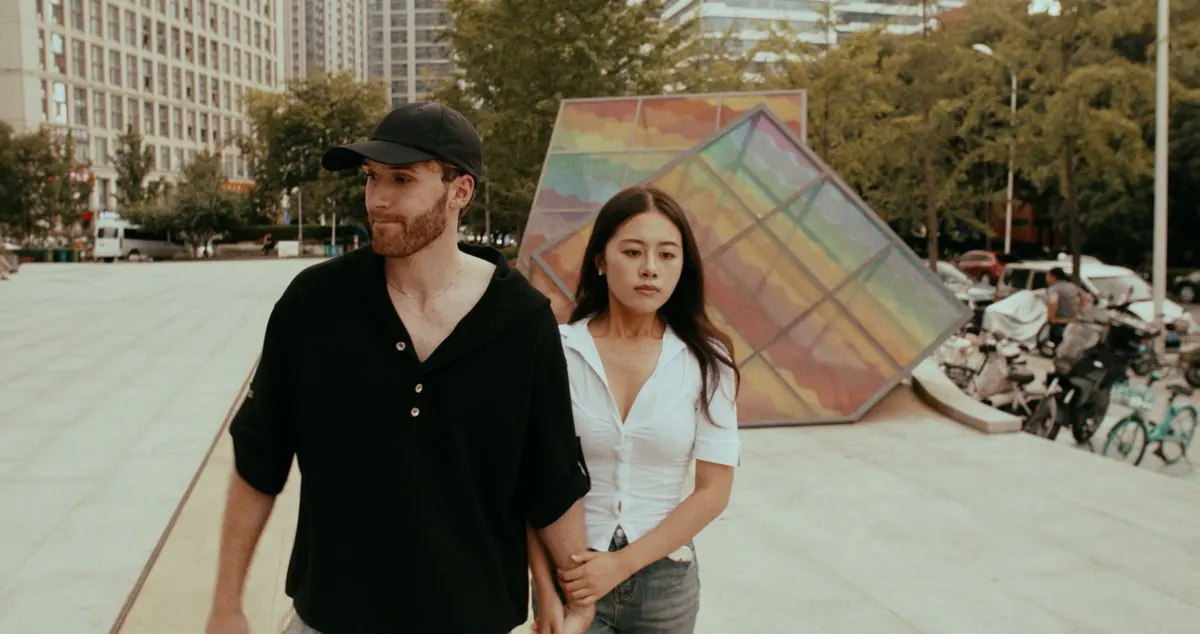 The teacher walking with a woman